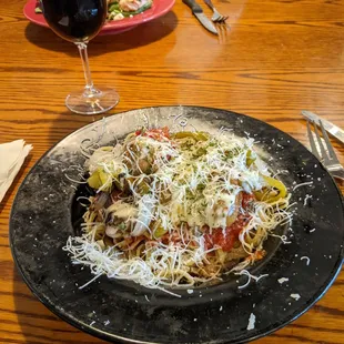 a plate of pasta and a glass of wine