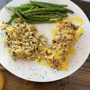 Pecan encrusted salmon with rice pilaf and green beans.