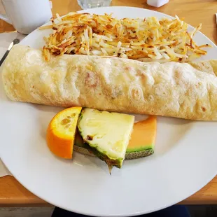 Tortilla with scambles egg, cheese, onions and a side of hashbrowns. Fresh fruit.
