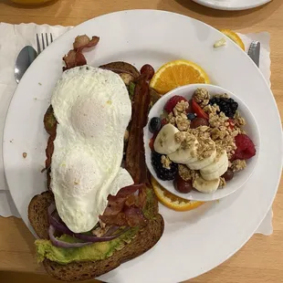Miami Avacado toast with dippy eggs and fresh fruit  and fresh squeezed OJ