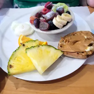 Poached egg with fresh fruit and an English muffin