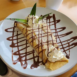 Banana crept,  with Hazelnut drizzle and fresh Banana