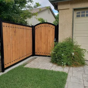 powder coated black iron frame w/ wood face gate w/ key pad entry