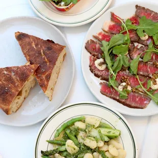 Tin of Spanish Sardines ($10); Sourdough Focaccia ($4); Rare Beef, Horseradish Crème Fraîche ($10); White Bean, Asparagus, Spring Onion ($8)