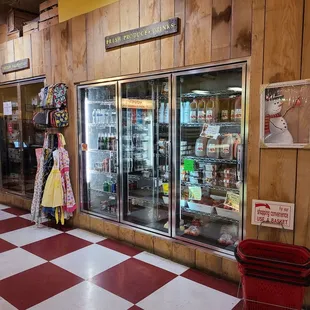 Refrigerator section apple cider and other items