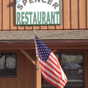 a flag flying in front of the restaurant