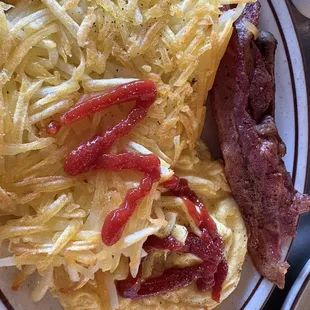 Golden hashbrowns, soft, scrambled eggs, bacon, and sausage, huge portion!