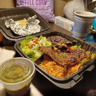 Mystery meat Carne Asada cooked to a chewy crisp with a side of watery guacomole.