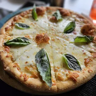 a pizza on a wooden board
