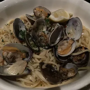 a bowl of pasta with clams