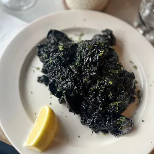 Risotto ai Nero di Seppia (squid ink risotto with clams/squid)
