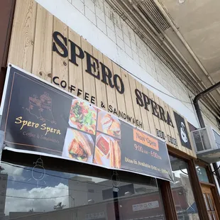 a sign for a coffee and sandwich shop