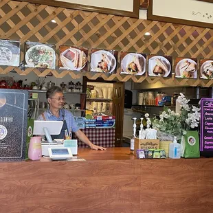 Kang&apos;s husband at the counter