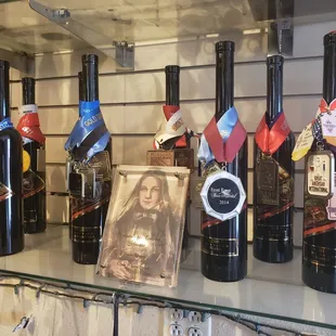 a display of wine bottles and medals