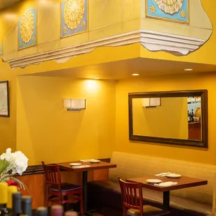 a restaurant with yellow walls