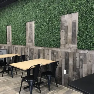 a dining area with tables and chairs