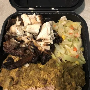 Small jerk chicken with rice and peas, curry goat gravy on the rice and steam cabbage. Very good