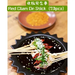 red clam on stick in a skillet