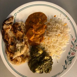 Garlic naan, rice, butter chicken, and palek paneer.