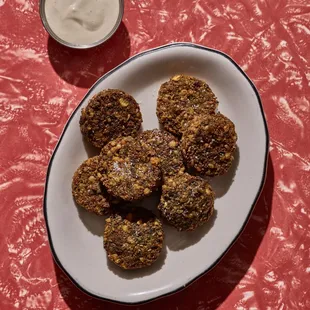 a plate of food and a cup of yogurt