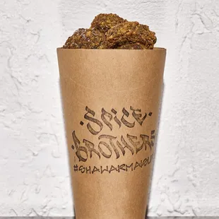 a cup of coffee with a cookie in it