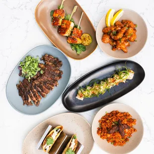 Salmon Satay, Ribeye, SPICE roll, Ahi Tuna Tacos, Accra Bowl