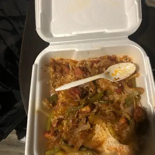 a container of food with a spoon in it