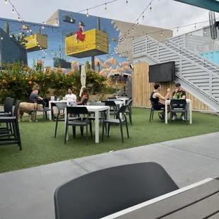 a patio with tables and chairs