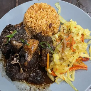 Oxtails, rice and peas and cabbage