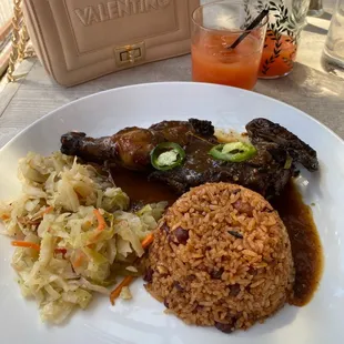 Jerk Chicken, steamed cabbage, rice and peas