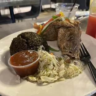 Port-au-Snapper (whole fried snapper), black rice and pickliz.