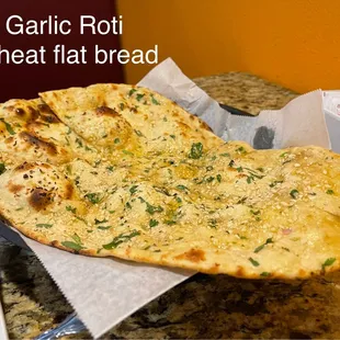 Garlic Roti. Perfect seasoning. Not heavy on garlic, as to take away from the sauces/entree, you dip into.