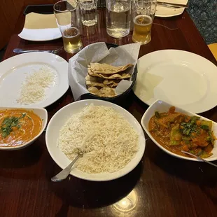 To the left: Paneer Makhani; in the middle: Basmati rice and a roti. To the right: Mixed vegetable curry.