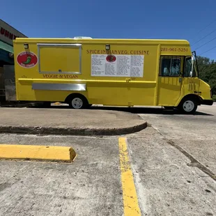 Operation side of truck, with service window and menu.