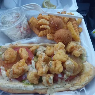 I got the shrimp Po boy everything on it cajun fries and I usually don't like hush puppies but those were good