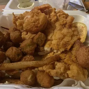 2 pieces whole filets With 6 fried shrimp okra, hush puppies