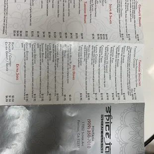 a close up of a menu on a table