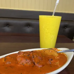  plate of food and a glass of orange juice