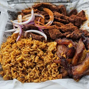Suya Steak with joll of rice and plantains yummy!!