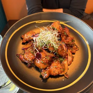 This is "chicken 65"... the best. We love this restaurant for the food, service, and the cool vibe!