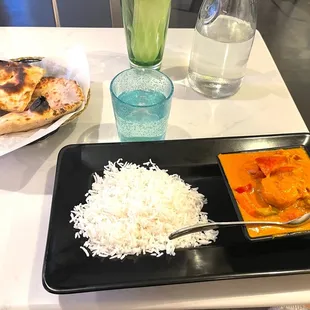 Shrimp &amp; veggies in a coconut tomato purée curry sauce w naan bread. Delish!