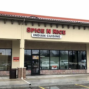 Restaurant Exterior (Dine-In Entry Left of Sign - Not Shown, Carry Out Entry Beneath Sign)