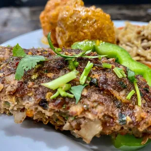 a plate of food with rice and meat