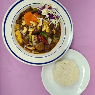 a bowl of stew and a plate of rice
