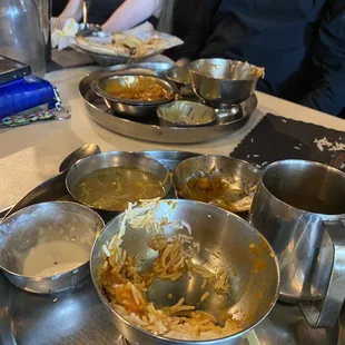 a table with bowls of food