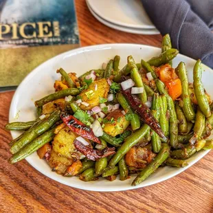 It&apos;s a North Indian curry made with green beans and potatoes, a sweet, salty, and spicy flavors in every bite. (Vegan Upon Request)