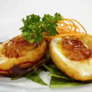 Caramelized Eggs - Eggs with golden yolk cooked to perfection covered with our special caramelized sauce