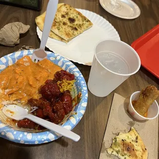 A SMALL Butter Chicken and Chicken 65 on Spicy Rice.