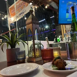 a plate of food and a bottle of wine