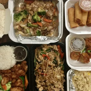 Top clockwise: Steamed rice, Pad See Eew, Spring Rolls, A2. Dumplings-pork, Side Fried Rice, Chicken basil, and Kid&apos;s Chicken Thai Cafe.